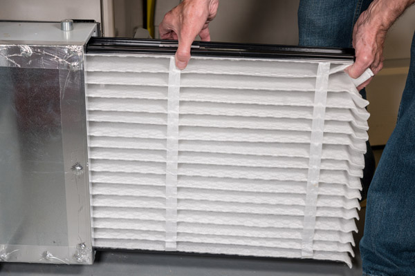 image of an oil-fired furnace filter replacement