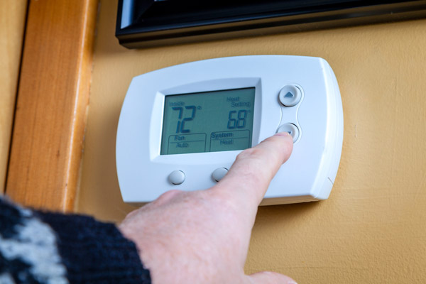 lowering thermostat to reduce energy costs