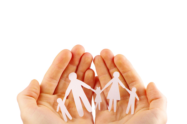 image of paper cut out of family in hands depicting co safety