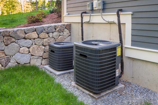 image of an outdoor air conditioning unit in summer
