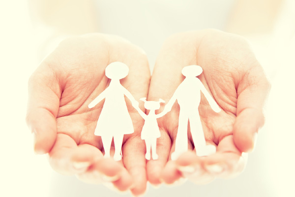 image of family paper cutout in hands depicting home heating safety