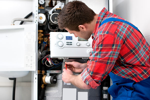 image of an hvac contractor performing a boiler repair