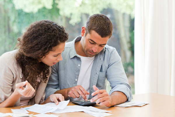 young couple calculating their home heating bills