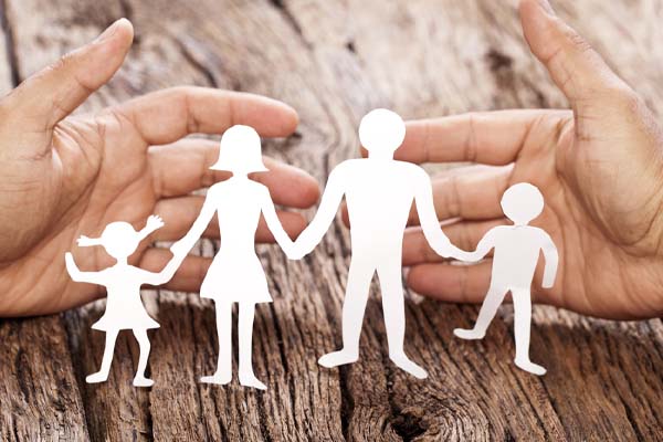 image of paper cut out of family in hands depicting propane safety