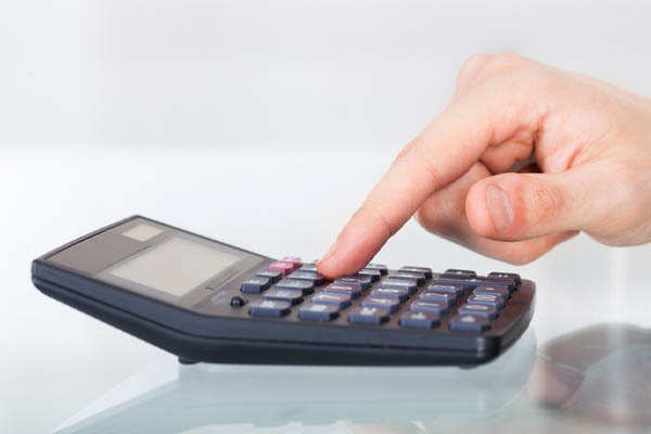 image of a homeowner calculating fuel costs of a power generator