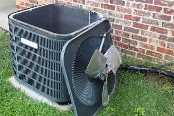 image of an air conditioner fan that is broken