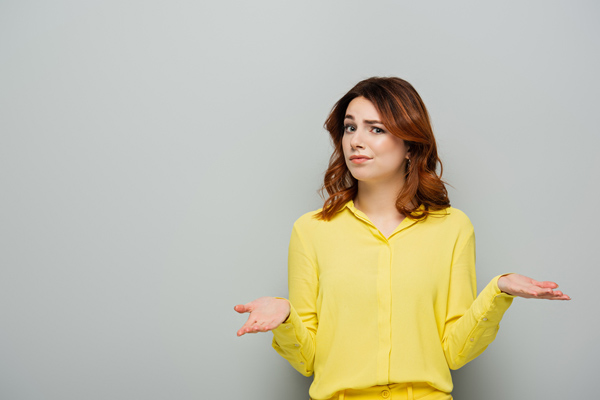 image of a homeowner wondering if she should buy a high-efficiency furnace