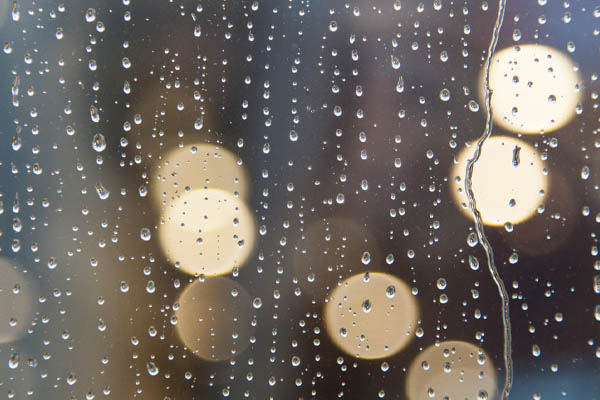 image of rainwater on widow depicting heating oil tank sludge and condensation