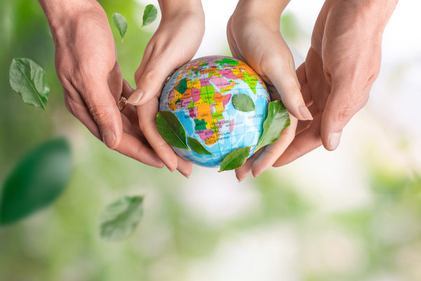 image of children holding earth depicting eco-friendly propane