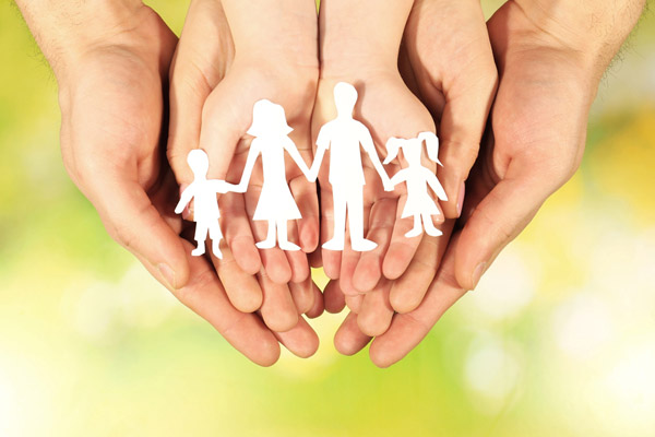 image of paper family in hands depicting propane safety