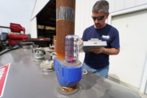 image of a commercial fuel delivery and a commercial fuel tank by tevis energy