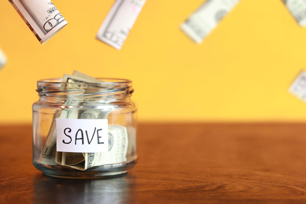 save jar depicting saving money with fuel oil
