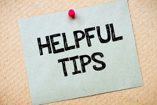Helpful Tips written on a paper and pinned on a board depicting air conditioner tips for summer