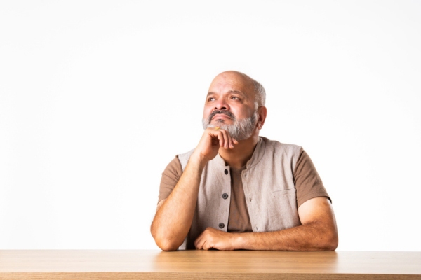 image of a thinking man depicting Choosing the Right AC System for Your Home